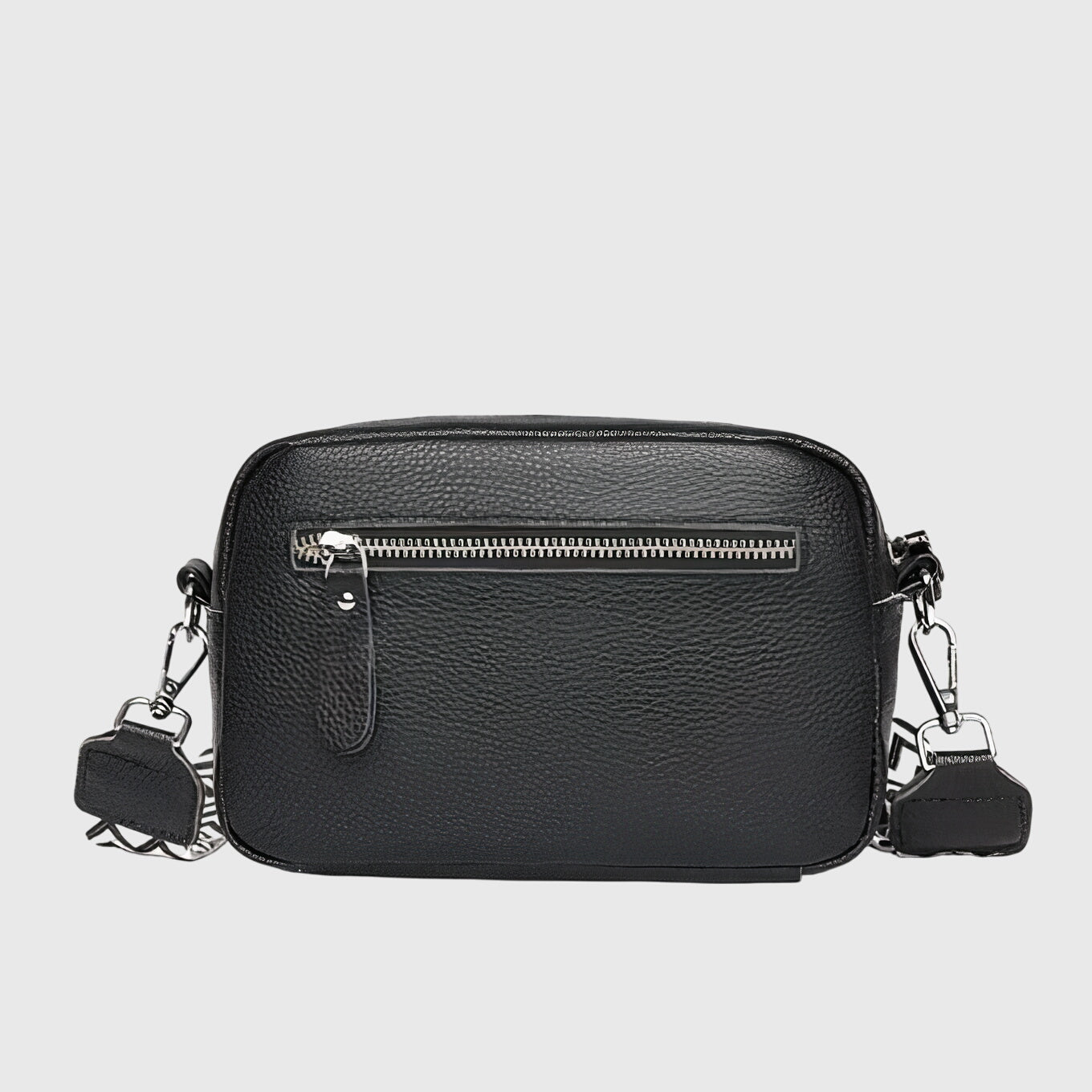 Sac à bandoulière en cuir noir, fermeture zippée visible, bandoulière et attaches métalliques.