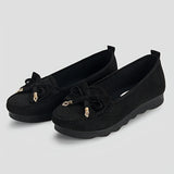 Mocassins noirs en daim avec nœud sur le dessus et pampilles décoratives dorées