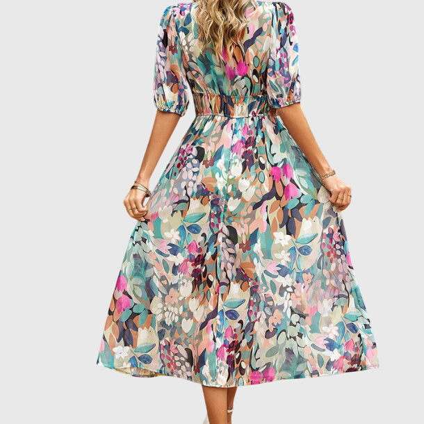 Robe midi à fleurs colorées vue de dos, manches bouffantes, taille froncée