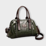 Sac à bandoulière vintage en cuir vert, anses rigides et fermeture zippée