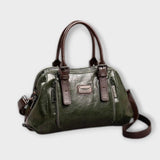 Sac à bandoulière vintage en cuir vert, anses rigides et fermeture zippée