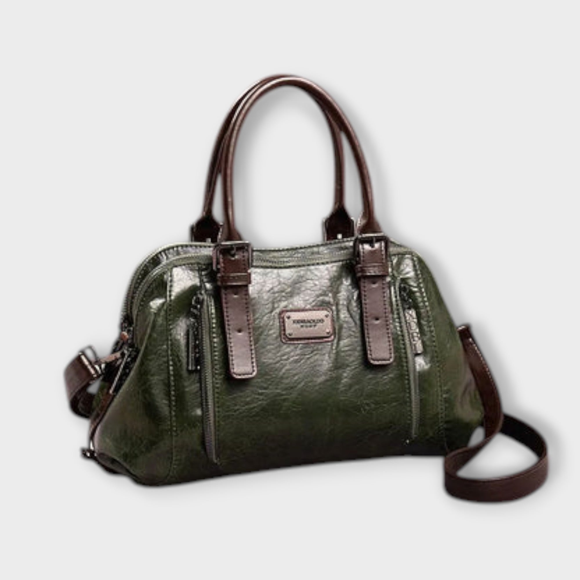 Sac à bandoulière vintage en cuir vert, anses rigides et fermeture zippée