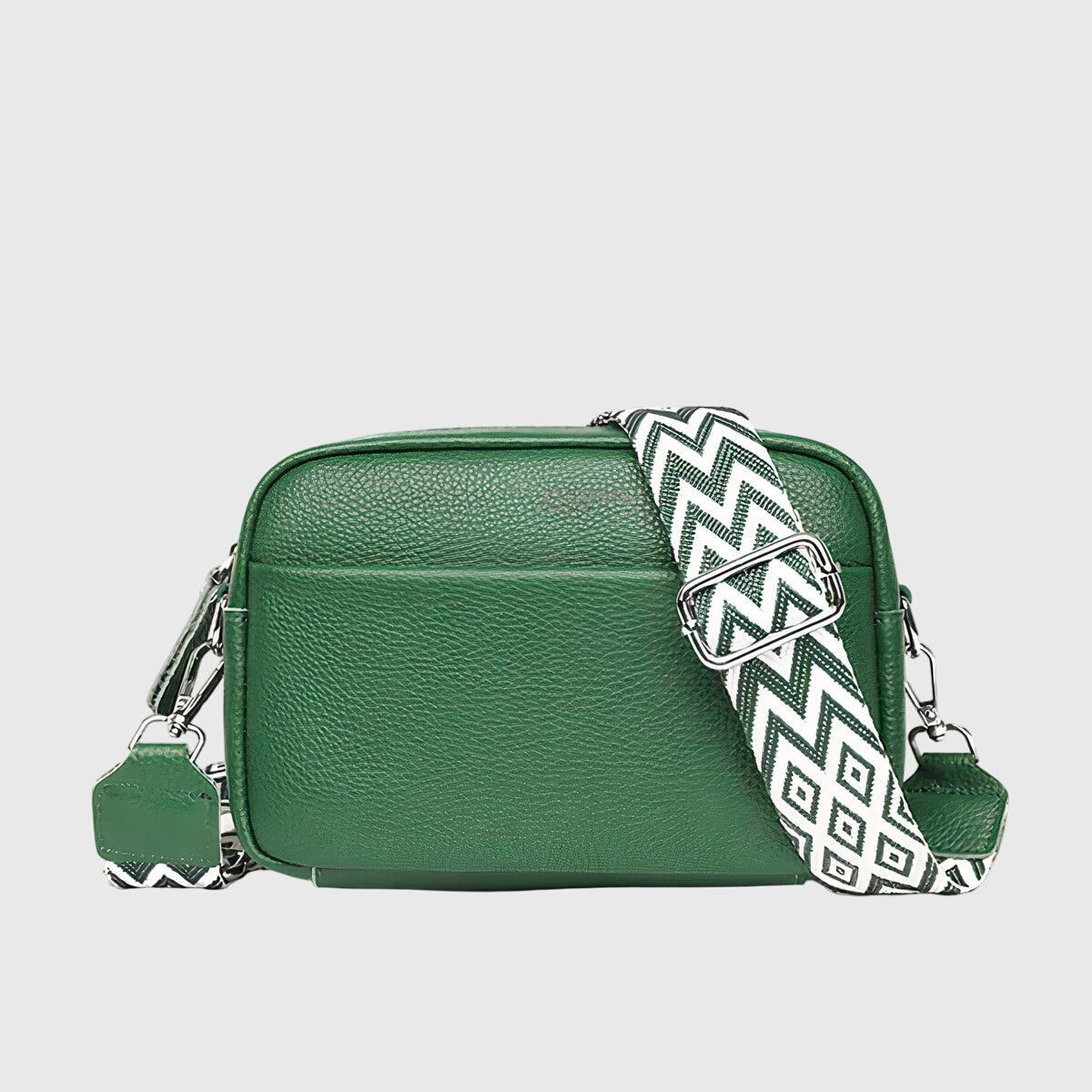 Sac à bandoulière en cuir vert, fermeture zippée, bandoulière à motif zigzag contrasté.