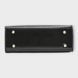 Dessous de sac à main en cuir effet crocodile brillant noir, avec pieds et boutons métalliques