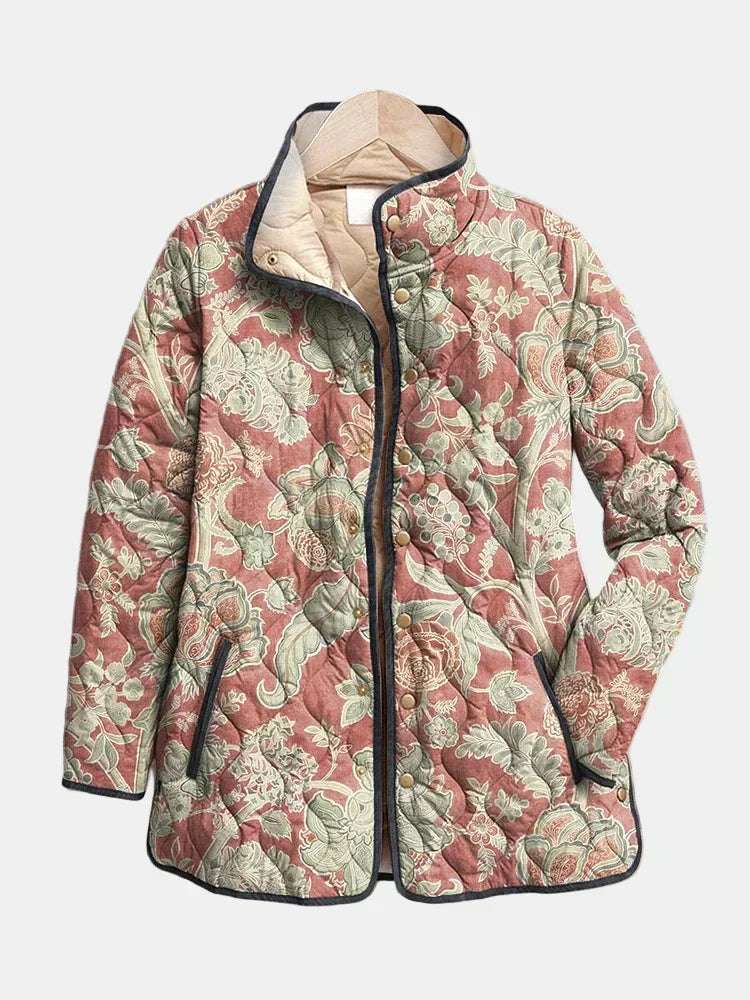 Veste matelassée à motifs floraux, col montant, fermeture boutonnée, poches latérales.