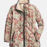 Veste matelassée à motifs floraux, col montant, fermeture boutonnée, poches latérales.