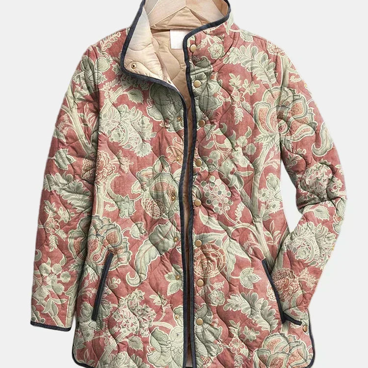 Veste matelassée à motifs floraux, col montant, fermeture boutonnée, poches latérales.