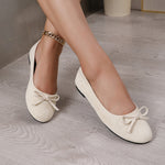Ballerines souples beige clair en textile velouté, nœud sur l’avant