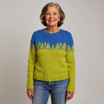 Pull en laine bleu/vert avec motif sapins jacquard, encolure ronde, manches longues.