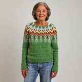 Pull en laine vert à motifs géométriques multicolores, col rond côtelé.