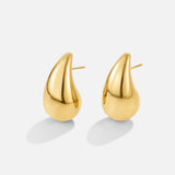 Anne – Boucles d’oreilles créoles en or avec une courbe délicate