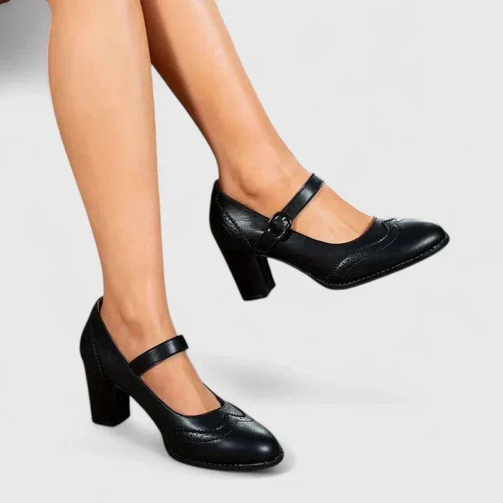 Chaussures bébé à talon noir, bride à boucle sur le cou-de-pied