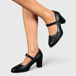 Chaussures bébé à talon noir, bride ajustable à boucle, dessus en cuir lisse