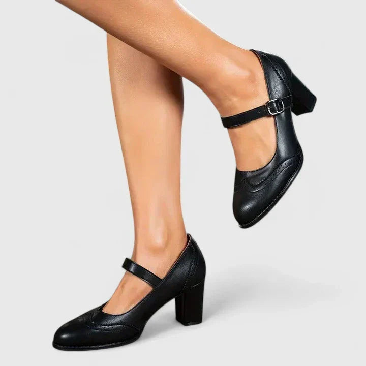 Chaussures bébé à talon noir, bride ajustable à boucle, dessus en cuir lisse