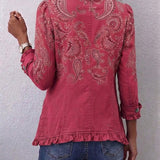 Veste rose à motif paisley, boutons au dos, bas et manches à volants
