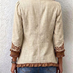 Veste bohème beige, dos avec coutures centrales et poignets bruns à volants