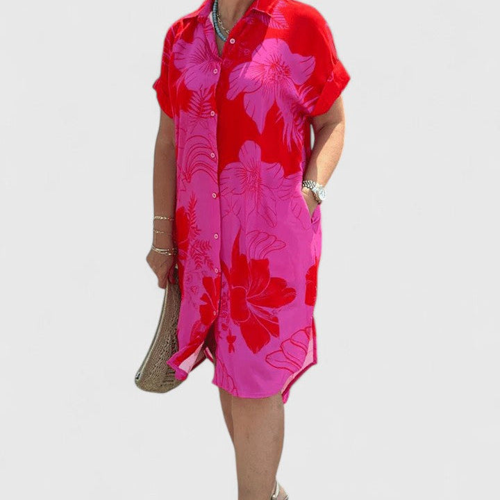 Robe rose à col chemise, manches courtes, imprimé floral, coupe droite.