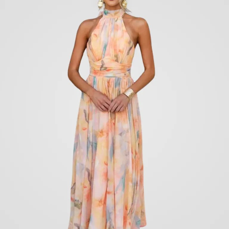 Robe midi fluide à col halter, imprimé pastel rose et bleu, taille cintrée, sans manches.