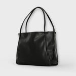 Sac Néréa Blair noir à anses, cuir lisse brillant, forme cabas avec devant plat